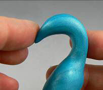 Blue clay being shaped